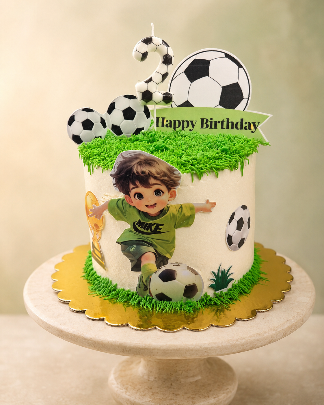 Soccer-themed birthday cake with green grass, football toppers and a cartoon player