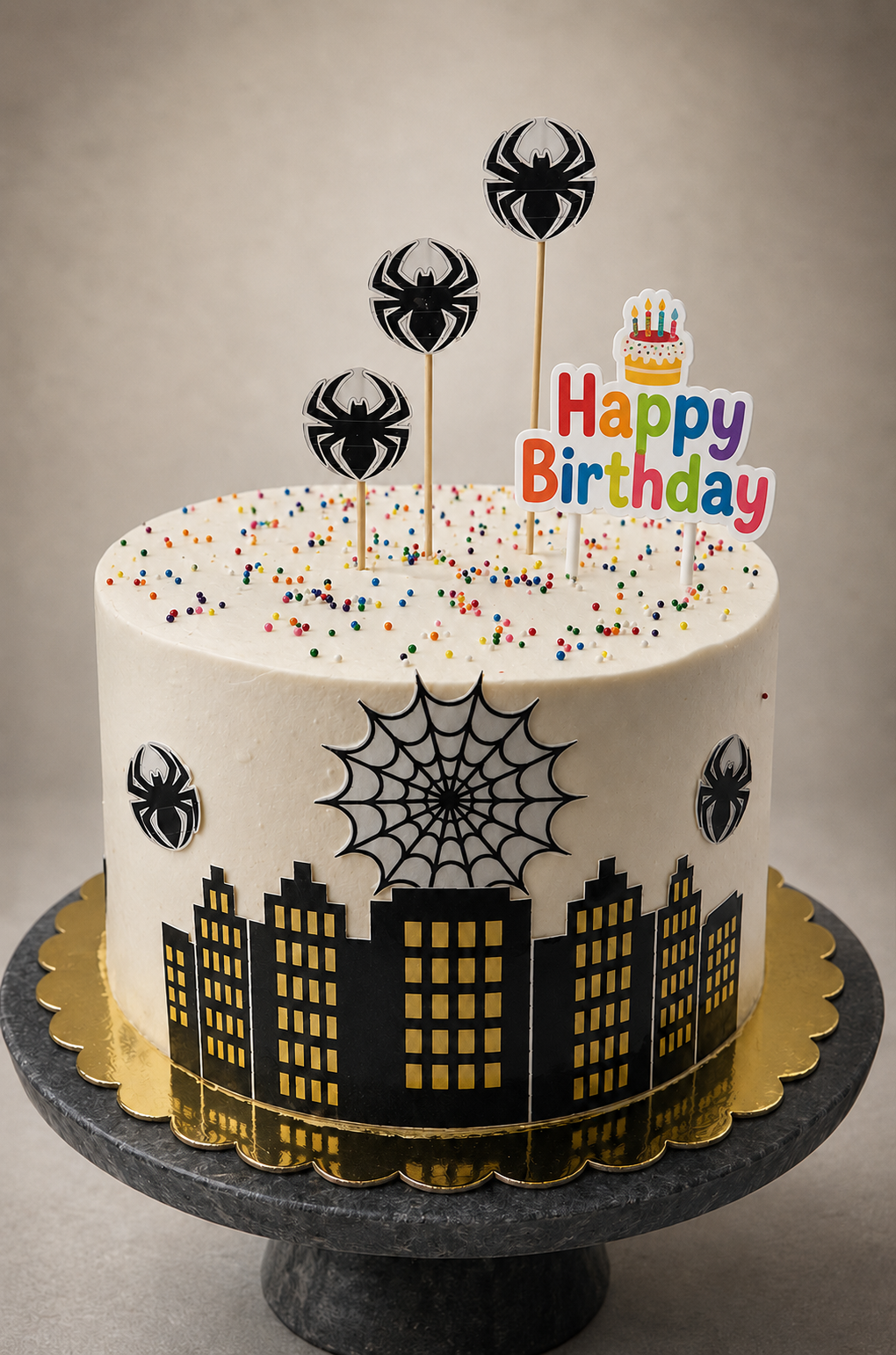 Spiderman city skyline birthday cake with sprinkles