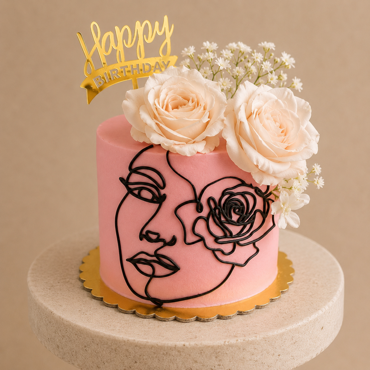 Pink buttercream cake with a hand-piped black single-line face design, topped with fresh cream roses and baby's breath